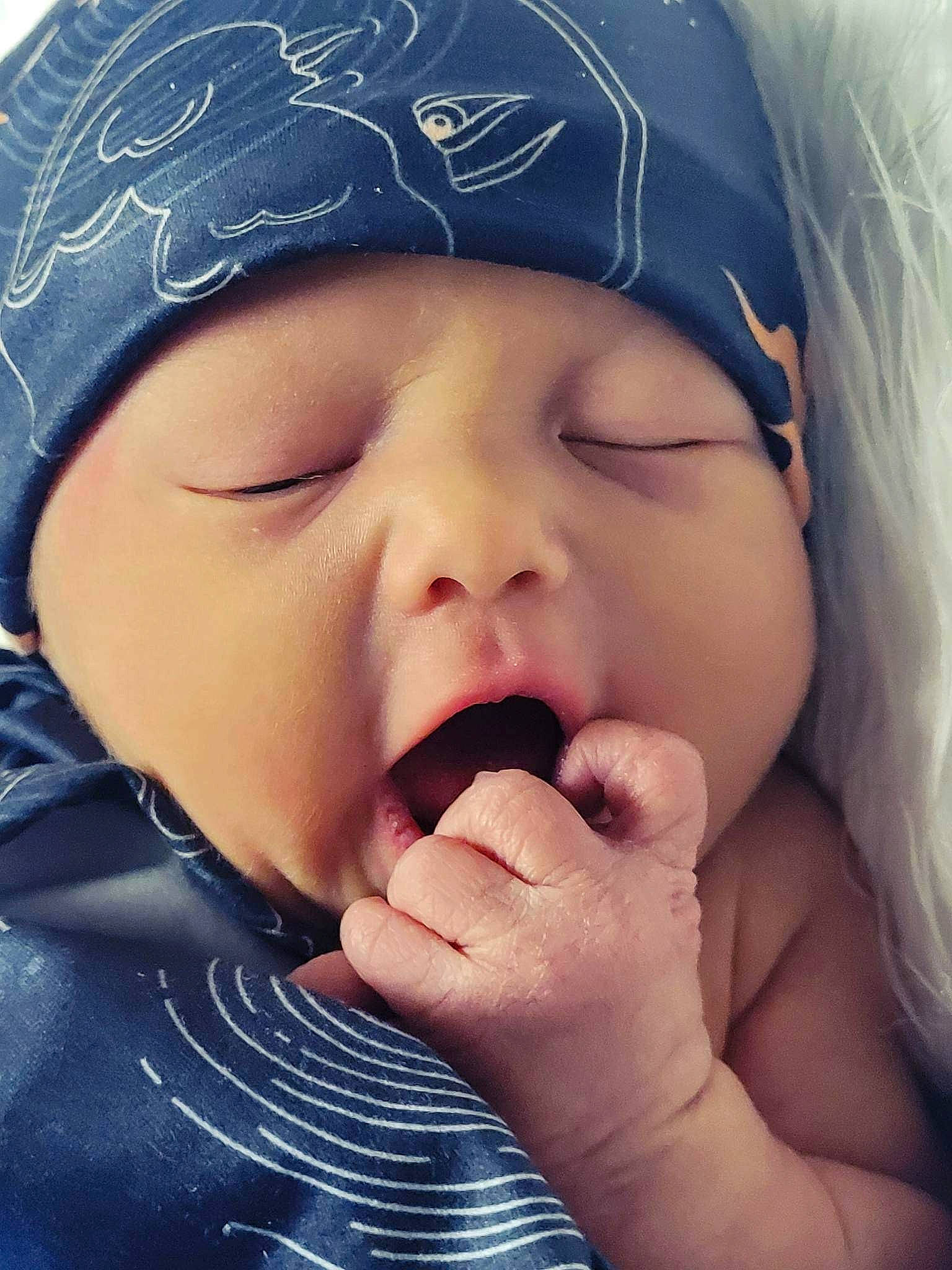Denver is registered to the contest to win money with this photo: baby, cap, cheek, child, close_up, eyebrow, eyelash, face, finger, fun, gesture, happy, headwear, lip, mouth, nose, people_in_nature, person, skin, smile