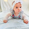 Riya joined the competition — help win amazing prizes! baby, child, infant, headband, bow, crawling, blue_eyes, striped_clothing, ruffles, long_sleeves, blanket, soft_light, portrait, indoors, cute, curious, pout, young, person, closeup