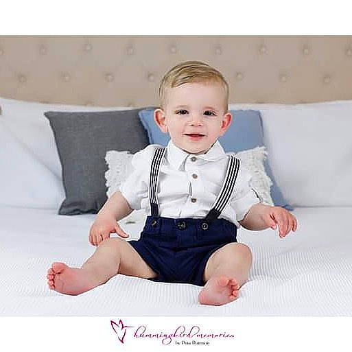 Jai is registered to the contest to win money with this photo: baby, baby_products, baby_toddler_clothing, bow_tie, child, child_model, clothing, design, formal_wear, outerwear, person, photograph, pink, product, sitting, sleeve, suit, tie, toddler, tuxedo