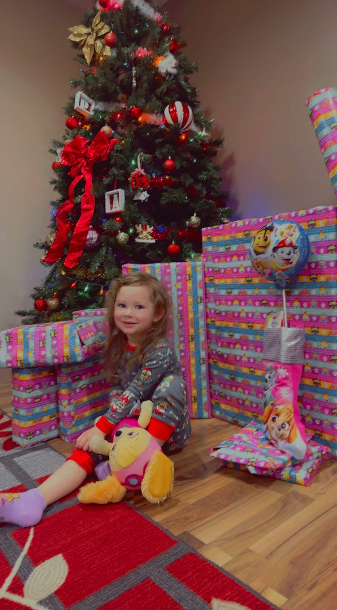 Adelaide joined the competition — help win amazing prizes! child, christmas_decoration, christmas_eve, christmas_ornament, christmas_tree, conifer, event, evergreen, face, holiday, holiday_ornament, joy, lap, ornament, pattern, person, pink, plant, snapshot, sock