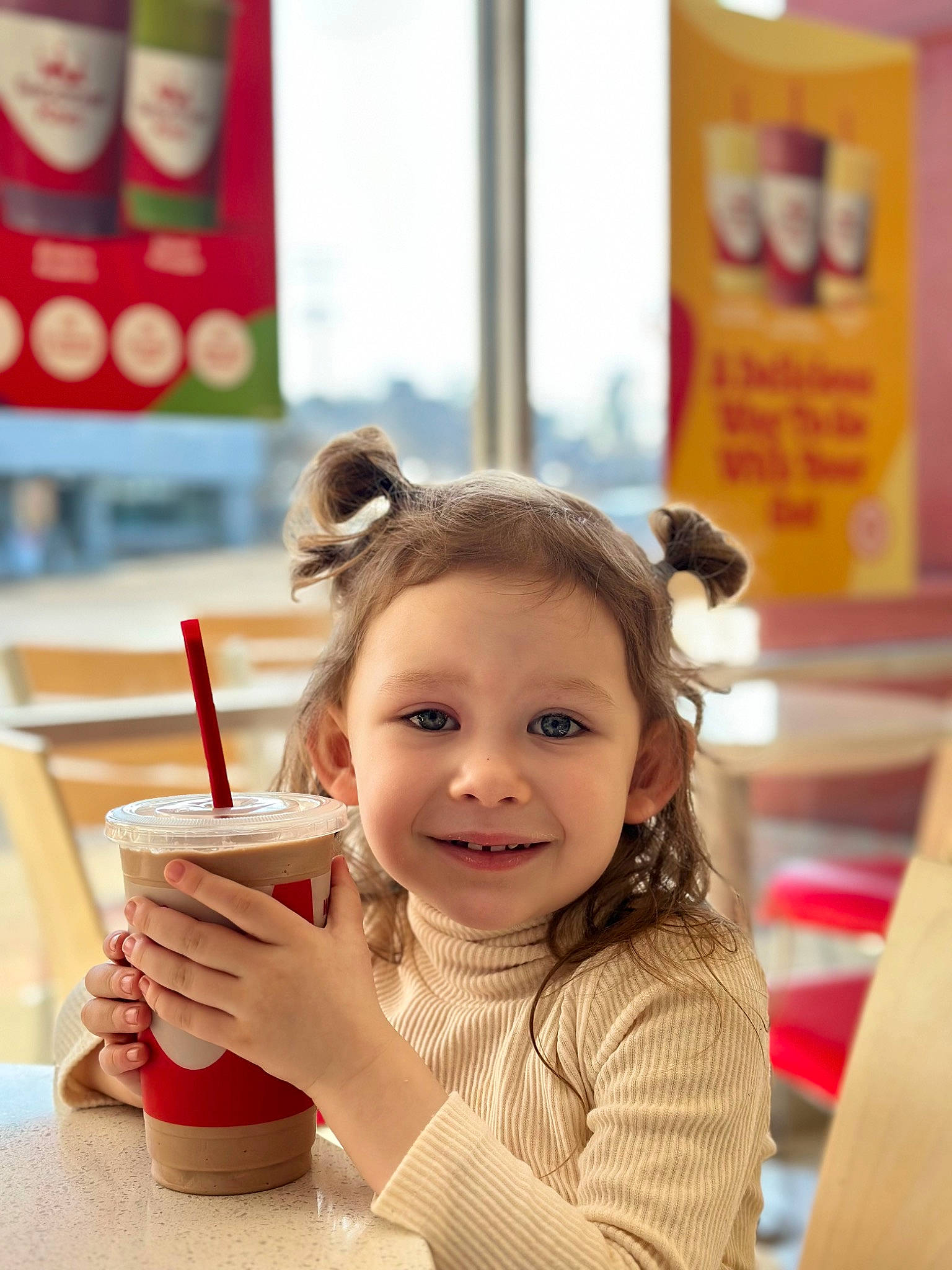 Adelaide is registered to the contest to win money with this photo: blond, brown_hair, child, cup, drink, drinking, drinking_straw, ear, eyelash, fun, hair_coloring, hairstyle, happy, joy, lip, person, room, skin, smile, sweetness
