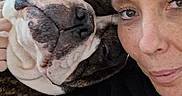 Tank is registered to the contest to win money with this photo: animal, black_hoodie, bulldog, close_up, comfort, cuddle, dog, expression, face, friendship, head, human, indoor, love, pet, portrait, relaxation, skin, snuggle, woman
