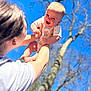 Elias joined the competition — help win amazing prizes! baby, child, person, adult, sky, tree, outdoor, smile, happy, holding, arms, nature, daylight, clothing, head, face, human, parent, playful, joy