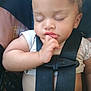 baby, sleeping, car_seat, child, infant, safety_strap, closed_eyes, hand, fingers, cute, peaceful, resting, young_child, seatbelt, clothing, portrait, indoors, soft_light, closeup, person