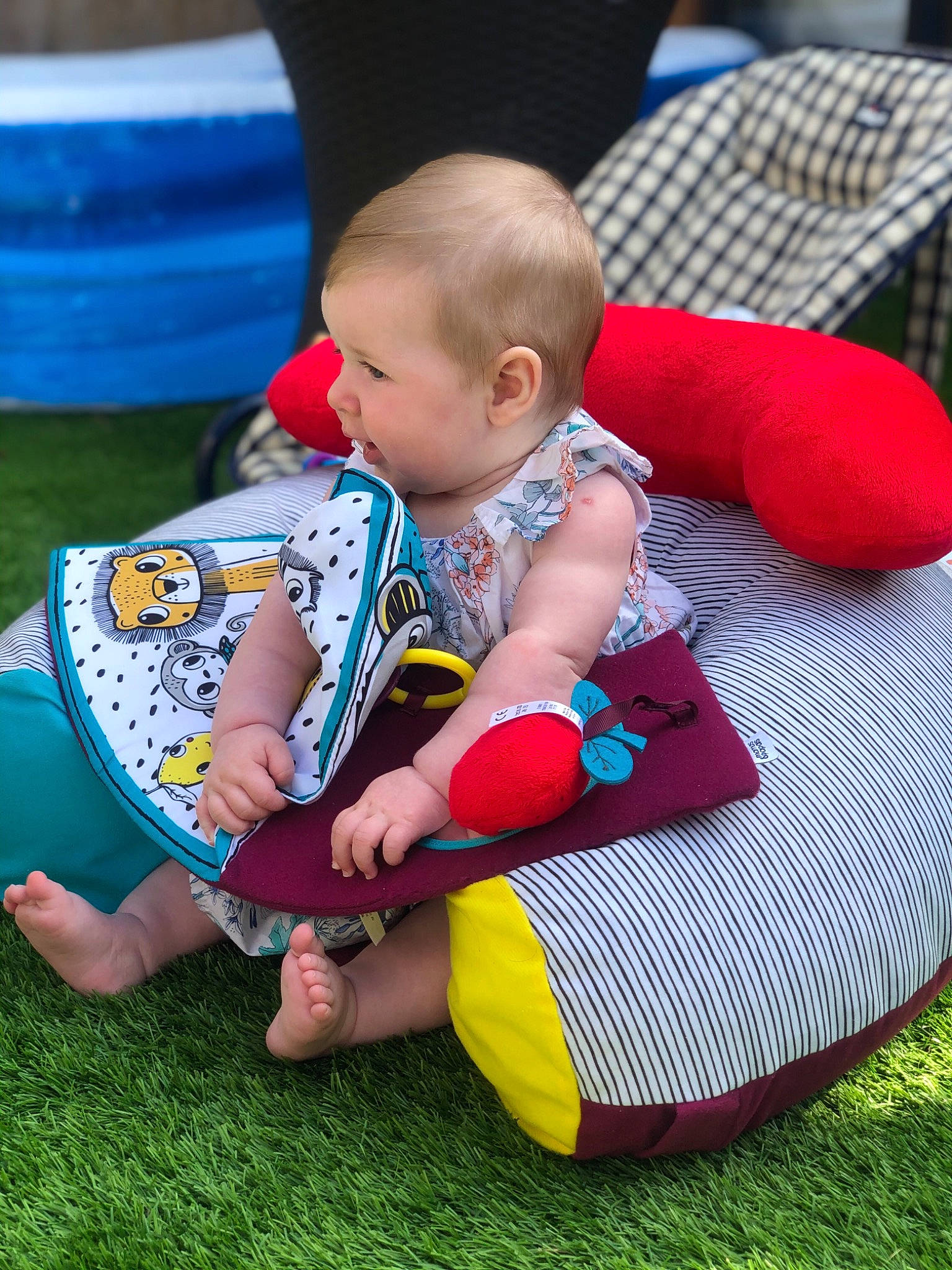 Amélie joined the competition — help win amazing prizes! baby, baby_toys, child, grass, lawn, leisure, person, play, product, sitting, summer, toddler, toy, vacation