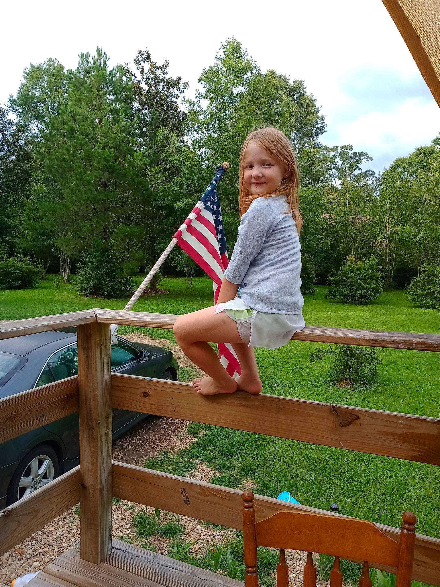 Kinslee joined the competition — help win amazing prizes! dress, fence, fun, grass, joy, landscape, leaf, leisure, people_in_nature, person, plant, recreation, shorts, sky, smile, standing, t_shirt, tire, toddler, tree