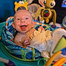 Atreus joined the competition — help win amazing prizes! baby, infant, child, smiling, happy, portrait, face, sitting, activity_seat, baby_toys, stuffed_toy, colorful, blanket, indoor, playtime, nursery, toy_robot, toy_alien, bottle, close_up