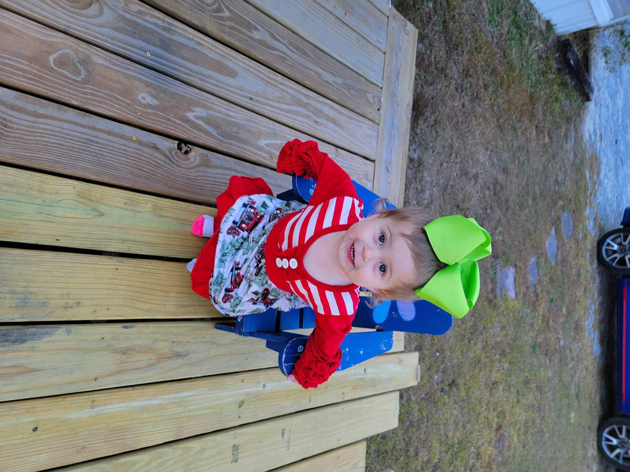 Katalyna is registered to the contest to win money with this photo: baby_toddler_clothing, child, door, electric_blue, fun, grass, happy, hardwood, hat, joy, leisure, person, plank, plant, red, siding, tire, toddler, wheel, wood