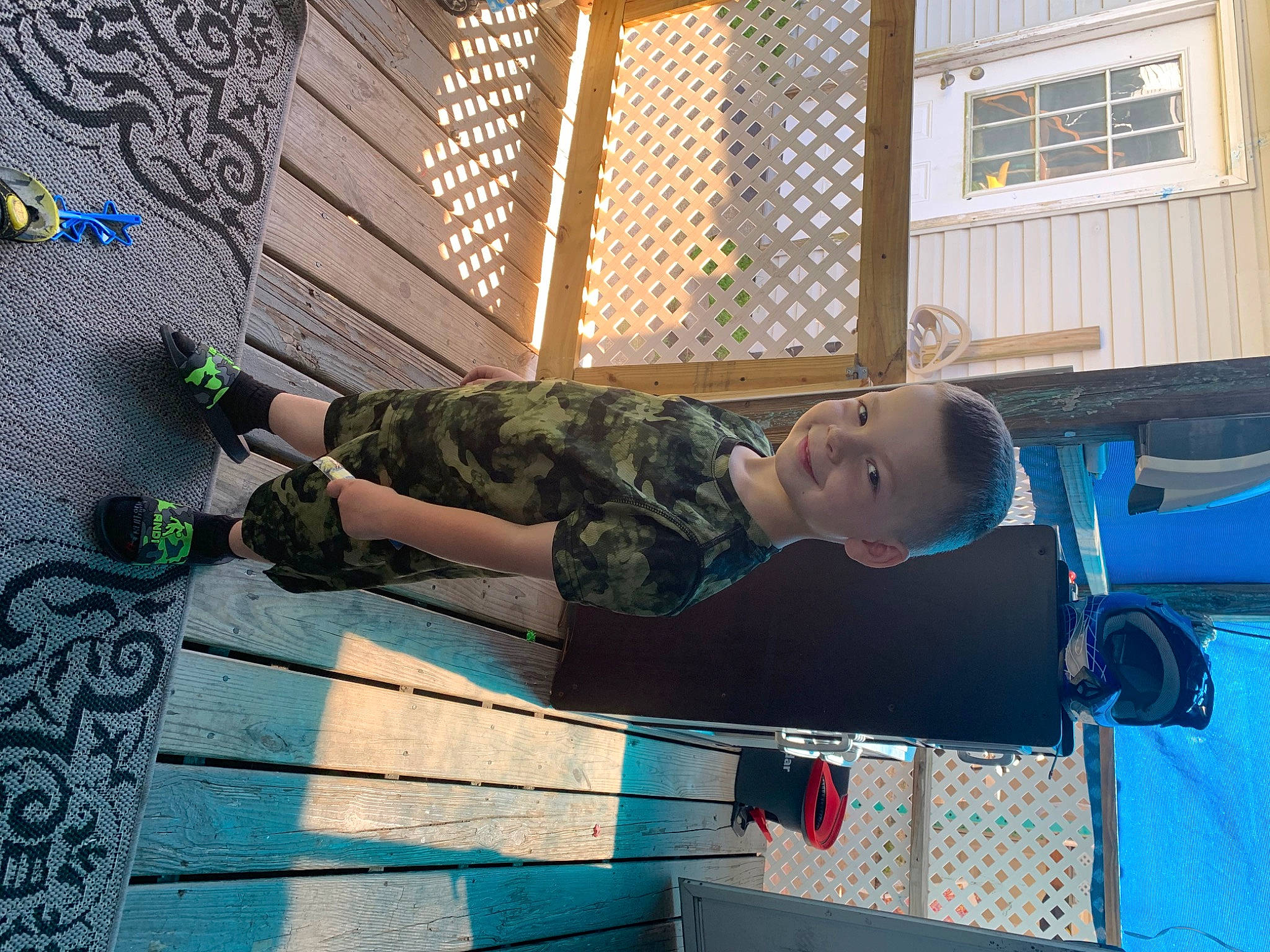 Baron joined the competition — help win amazing prizes! child, elbow, electric_blue, flooring, fun, human_leg, joint, joy, knee, leisure, pattern, person, recreation, shorts, sitting, stairs, t_shirt, thigh, toddler, window