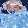 Mylann participe au concours pour gagner de l'argent avec cette photo : baby, infant, pacifier, blanket, star_pattern, hood, blue_eyes, closeup, face, cute, child, soft_texture, warm, cozy, indoor, portrait, person, wrapped, sleepy, adorable