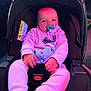 baby, pacifier, car_seat, child, infant, clothing, pink_lighting, purple_lighting, indoor, seatbelt, soft_toys, cute, person, young_child, face, hand, sitting, cozy, warm_clothing, car_accessory