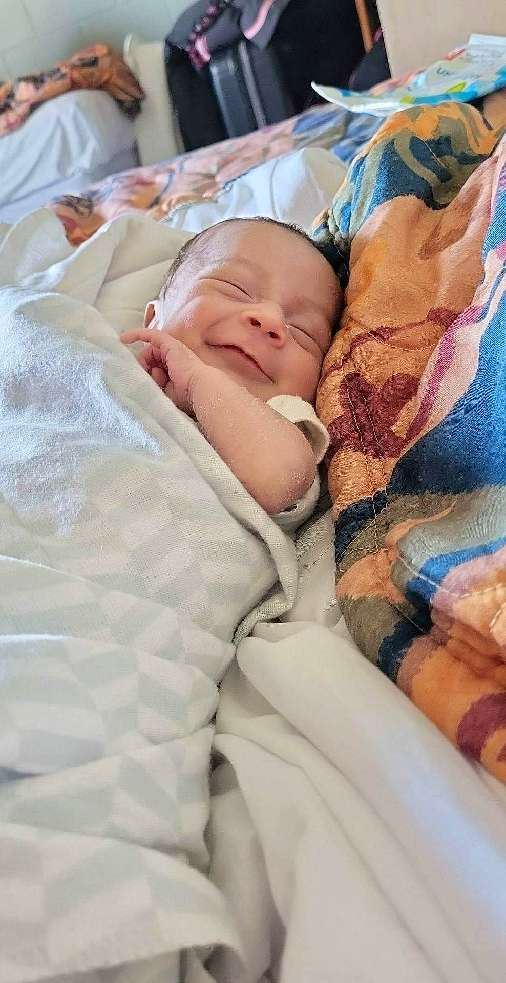 Jenna is registered to the contest to win money with this photo: baby, baby_products, baby_sleeping, baby_toddler_clothing, bedding, bedtime, child, comfort, flesh, hat, linens, nap, pattern, peach, person, room, skin, sleep, toddler