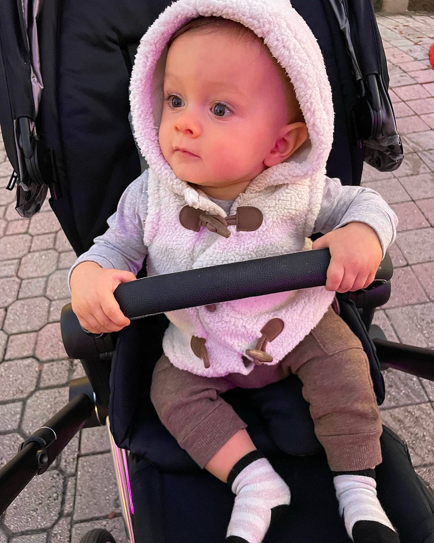 Ford is registered to the contest to win money with this photo: baby, baby_carriage, baby_products, baby_safety, baby_toddler_clothing, cap, carmine, chair, cheek, child, comfort, face, lap, person, photograph, pink, product, sitting, skin, thigh