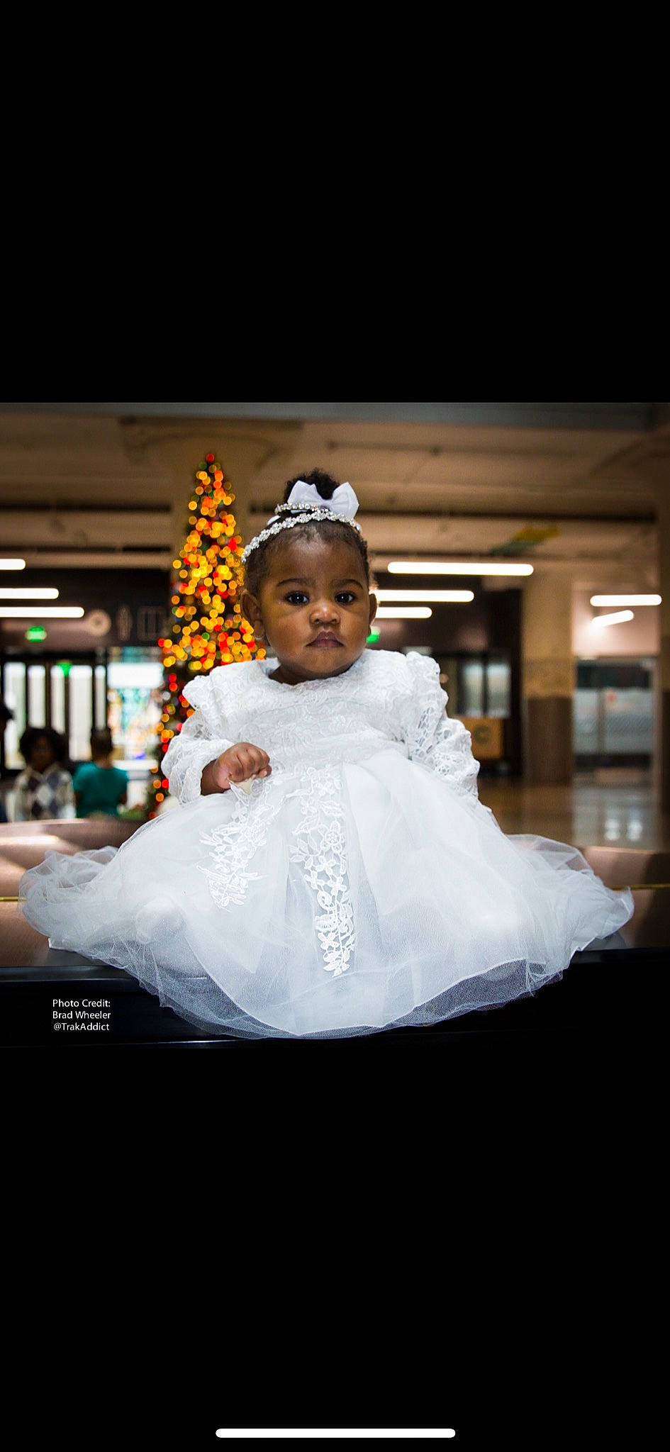Zion is registered to the contest to win money with this photo: baby, bride, ceremony, child, dress, event, flower_girl, fun, gown, groom, happy, headpiece, male, person, photograph, photography, smile, toddler, tradition, wedding