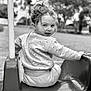 black_and_white, casual, child, clothing, expression, face, fun, hair, nature, outdoor, park, person, play, playground, seat, smiling, swing, toddler, trees, young