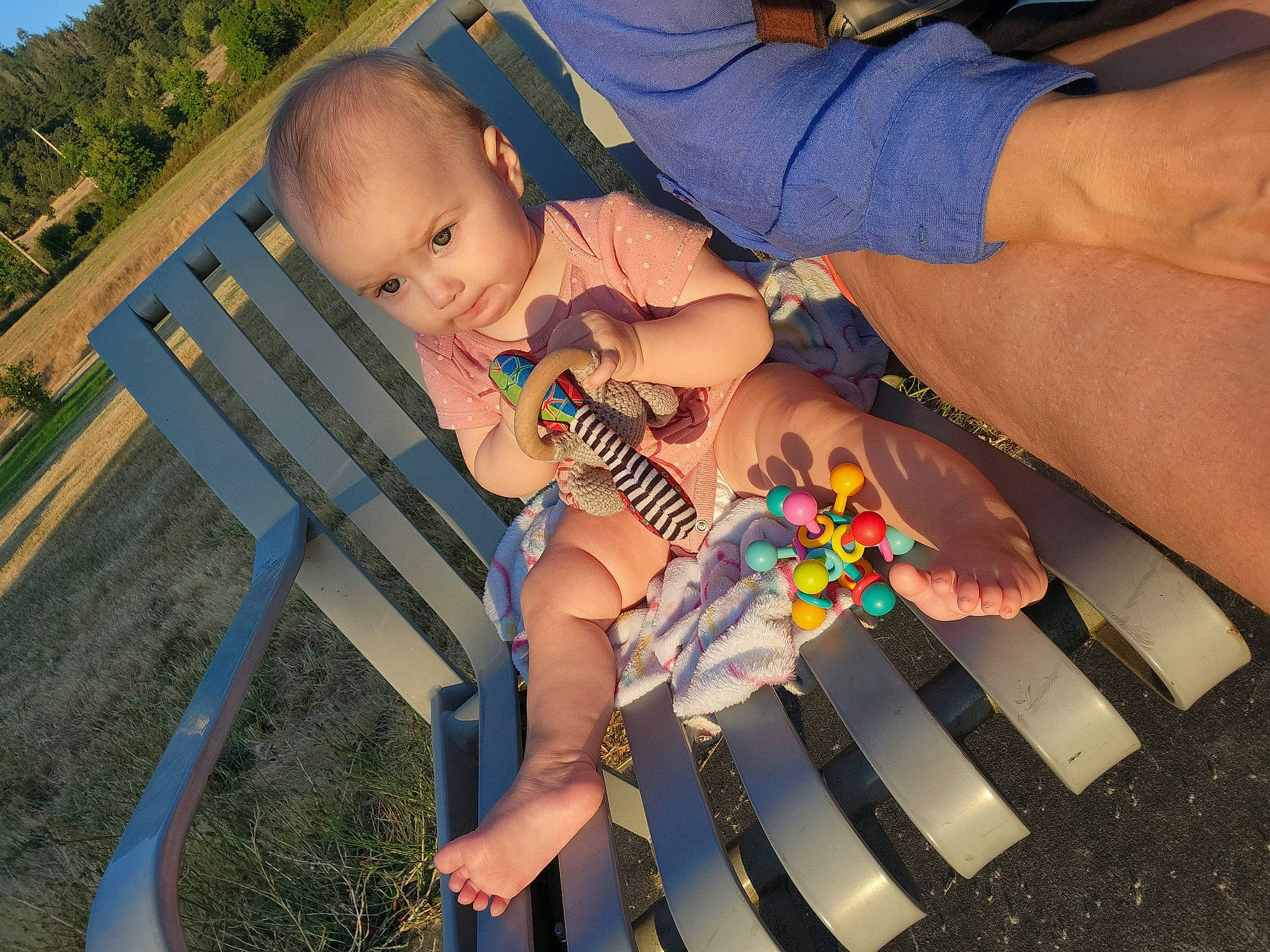 Izabella Jay Riddle is registered to the contest to win money with this photo: baby, baby_toddler_clothing, child, foot, fun, grass, hand, happy, human_leg, leisure, nail, outdoor_furniture, people_in_nature, person, plant, recreation, sitting, sky, thigh, toddler