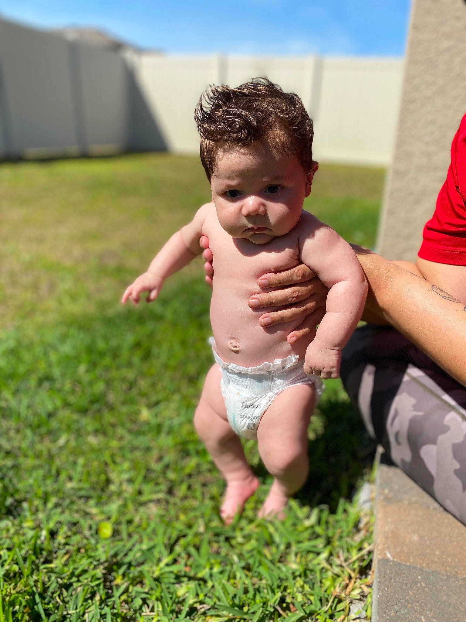 Ryland joined the competition — help win amazing prizes! arm, baby, barechested, barefoot, gesture, grass, grass_family, grassland, happy, human_leg, leg, leisure, meadow, people_in_nature, person, plant, shorts, sky, thigh, thumb