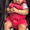 baby, child, infant, car_seat, pink_overalls, socks, sitting, portrait, face, hands, curious, indoor, close_up, harness, clothing, textile, automobile,  안전, photography, cute