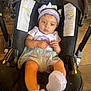 baby, child, stroller, headband, purple, outfit, shoes, indoor, floor, seat, infant, person, cute, clothing, footwear, looking, hands, legs, expression, relaxed