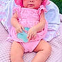 baby, infant, pink_dress, sunhat, teething_toy, blanket, grass, outdoor, child, cute, sitting, sock, summer, portrait, closeup, person, soft_texture, young_child, baby_girl, playtime