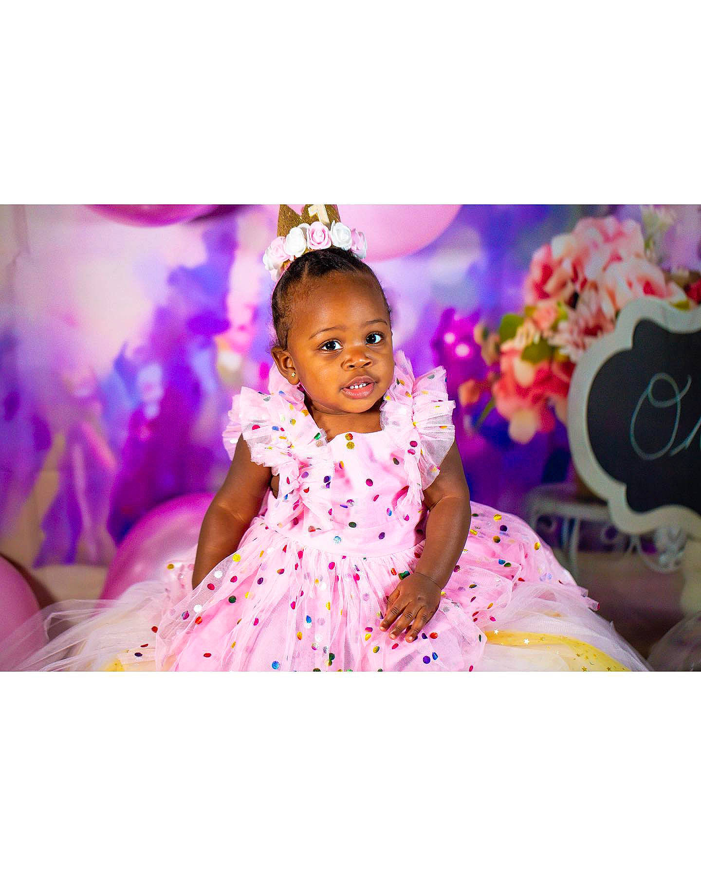 Ivy is registered to the contest to win money with this photo: baby, dress, event, fashion_accessory, fashion_design, flash_photography, fun, happy, leisure, magenta, pattern, peach, person, petal, pink, purple, sitting, sleeve, toddler, tradition