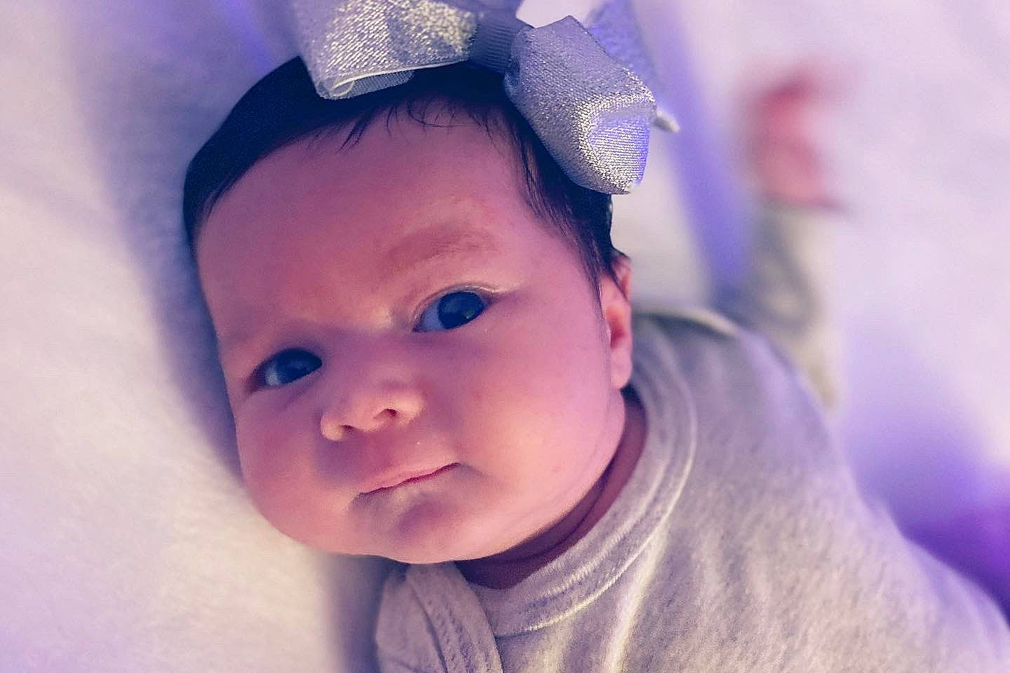 Jaelynn is registered to the contest to win money with this photo: baby, beauty, cheek, child, chin, ear, eye, eyebrow, face, forehead, hair_accessory, head, human, lip, nose, person, pink, purple, skin, smile