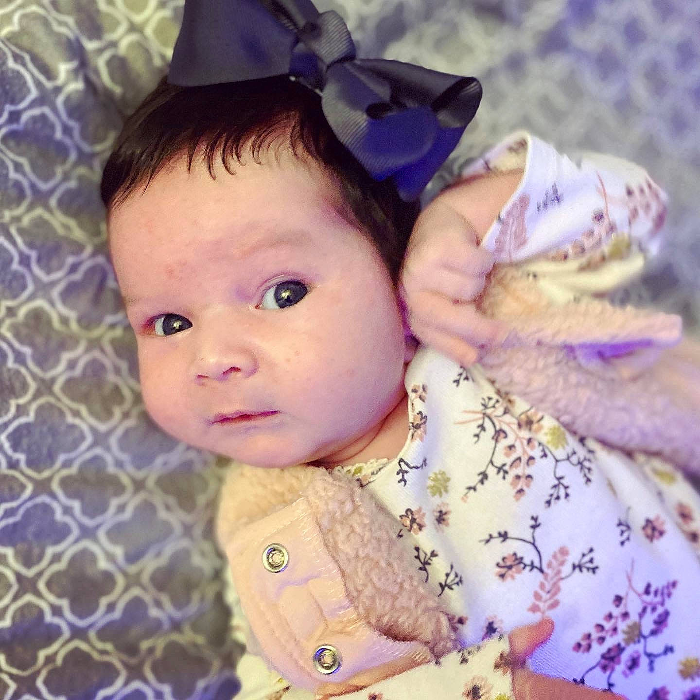 Jaelynn is registered to the contest to win money with this photo: baby, beauty, cheek, child, ear, eye, face, forehead, hair_accessory, head, iris, lavender, lip, nose, organ, person, pink, product, purple, skin