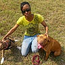 animal, brown_dog, canine, casual, dog, friendship, grass, happy, jeans, leash, nature, outdoor, panting, person, pet, playful, summer, sunglasses, sunlight, yellow_shirt
