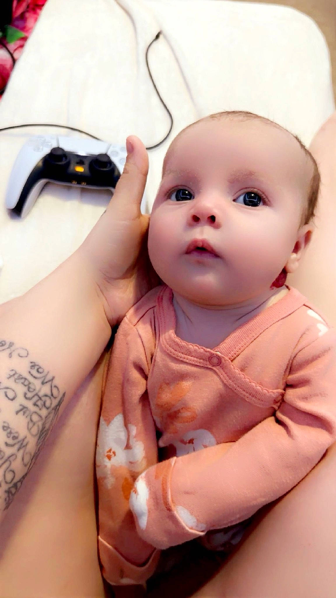 Octavia is registered to the contest to win money with this photo: baby, baby_toddler_clothing, cheek, ear, eye, eyelash, finger, gesture, hand, happy, iris, lip, mouth, muscle, neck, nose, person, skin, sleeve, stomach