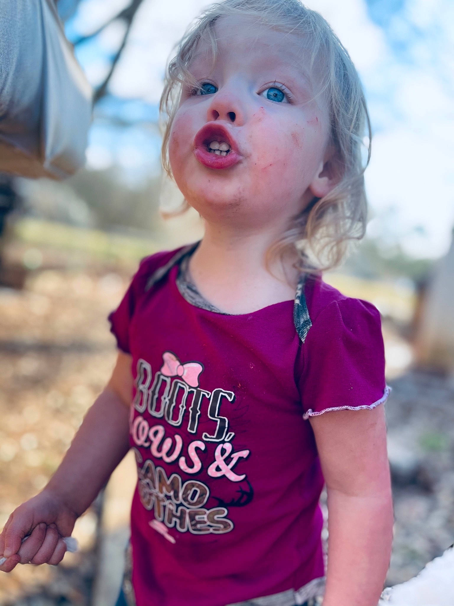 Layla is registered to the contest to win money with this photo: baby, baby_toddler_clothing, child, electric_blue, face, fun, grass, hairstyle, happy, iris, lip, magenta, neck, person, pink, purple, skin, sleeve, summer, sunlight