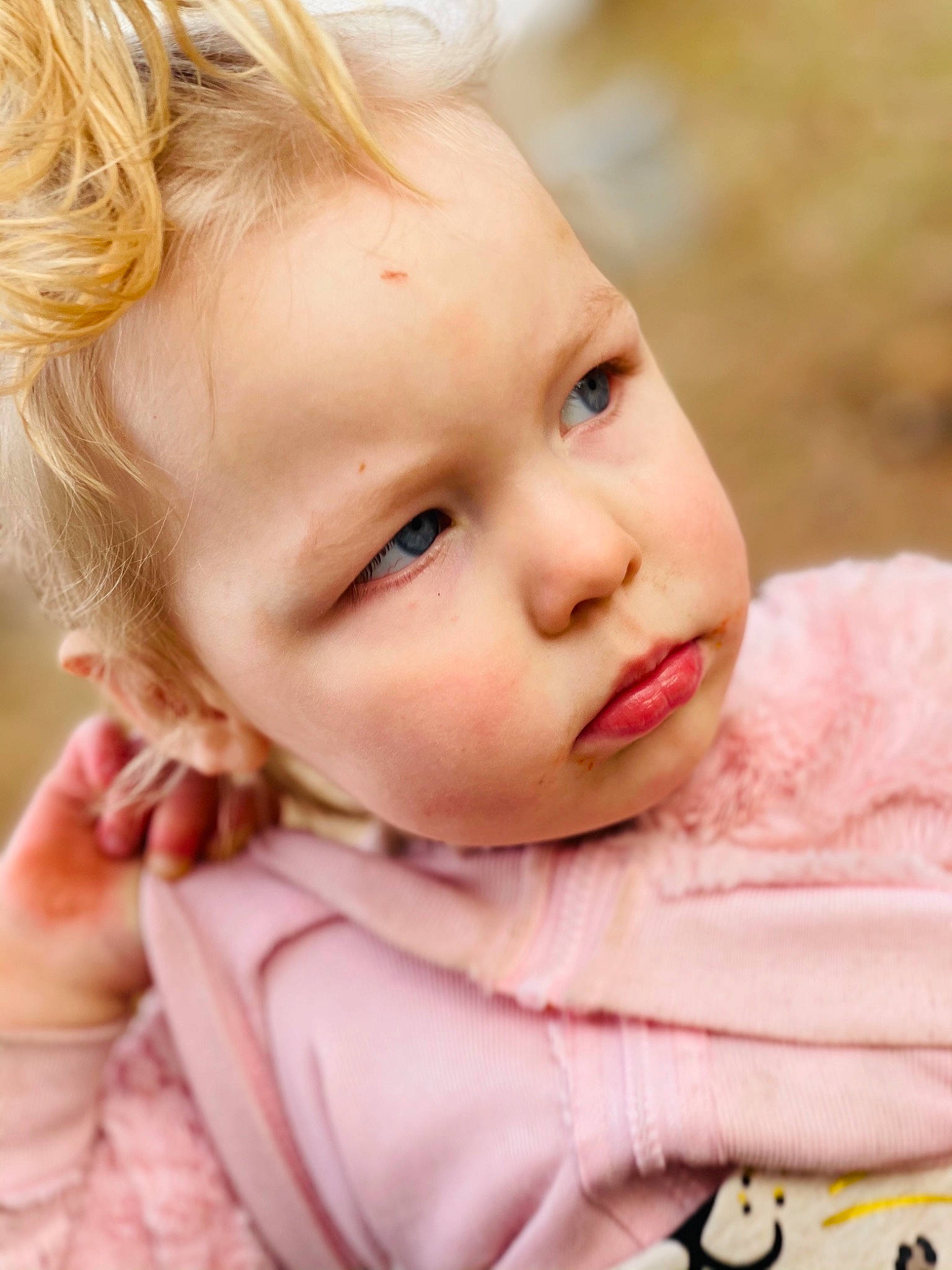 Layla is registered to the contest to win money with this photo: baby, baby_toddler_clothing, cheek, child, close_up, collar, ear, eye, eyelash, finger, grass, happy, iris, lip, neck, nose, person, pink, skin, sleeve