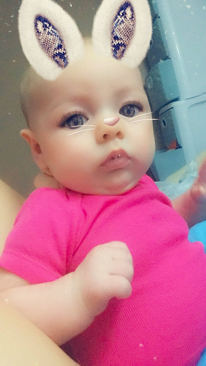 Layla is registered to the contest to win money with this photo: cheek, child, ear, eye, eyebrow, face, forehead, girl, head, human_hair_color, infant, iris, lip, nose, organ, person, pink, product, skin, smile