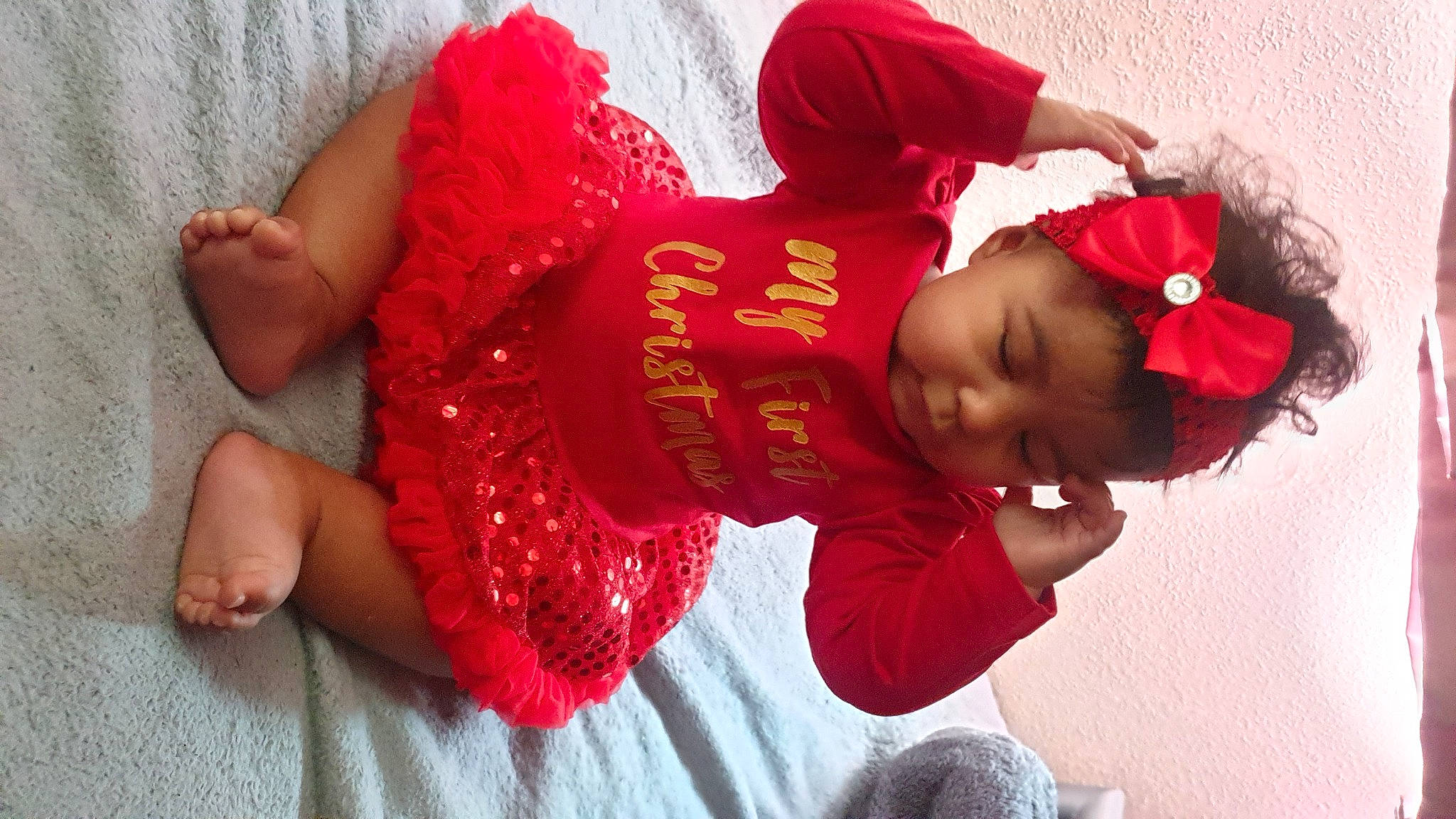 Emilee is registered to the contest to win money with this photo: baby, baby_toddler_clothing, barefoot, child, costume_accessory, foot, hair_accessory, headband, headgear, love, person, red, toddler, toe