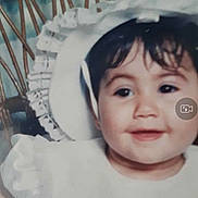 Salima participe au concours pour gagner de l'argent avec cette photo : baby, child, smile, white_clothing, bonnet, face, headwear, portrait, cute, infant, seated, wicker_chair, background, indoor, soft_lighting, closeup, happy, person, young, frills