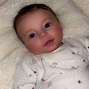 Leily participe au concours pour gagner de l'argent avec cette photo : baby, infant, blanket, onesie, soft_texture, cozy, cute, face, portrait, child, sleepwear, lying_down, newborn, indoors, comfort, skin, expression, adorable, small, peaceful