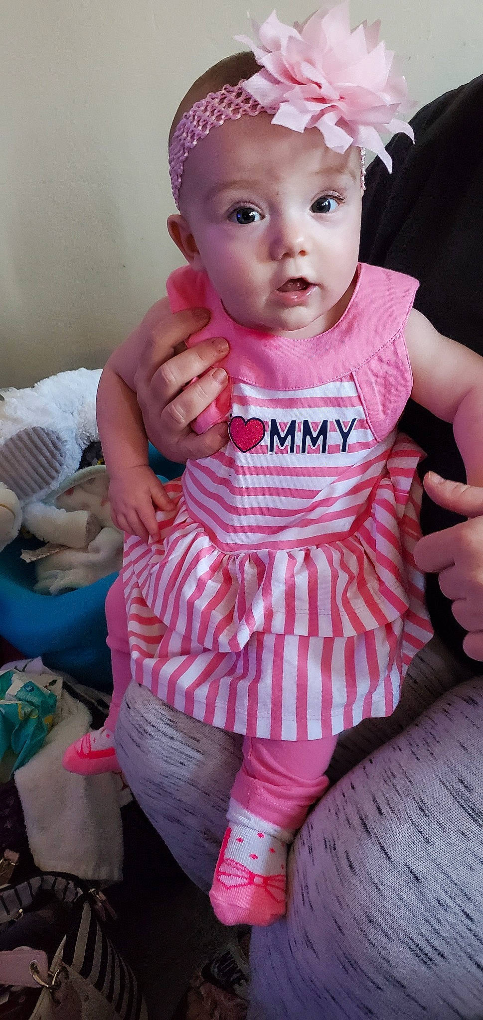 Stormi is registered to the contest to win money with this photo: baby, baby_products, baby_toddler_clothing, cheek, child, person, pink, product, toddler