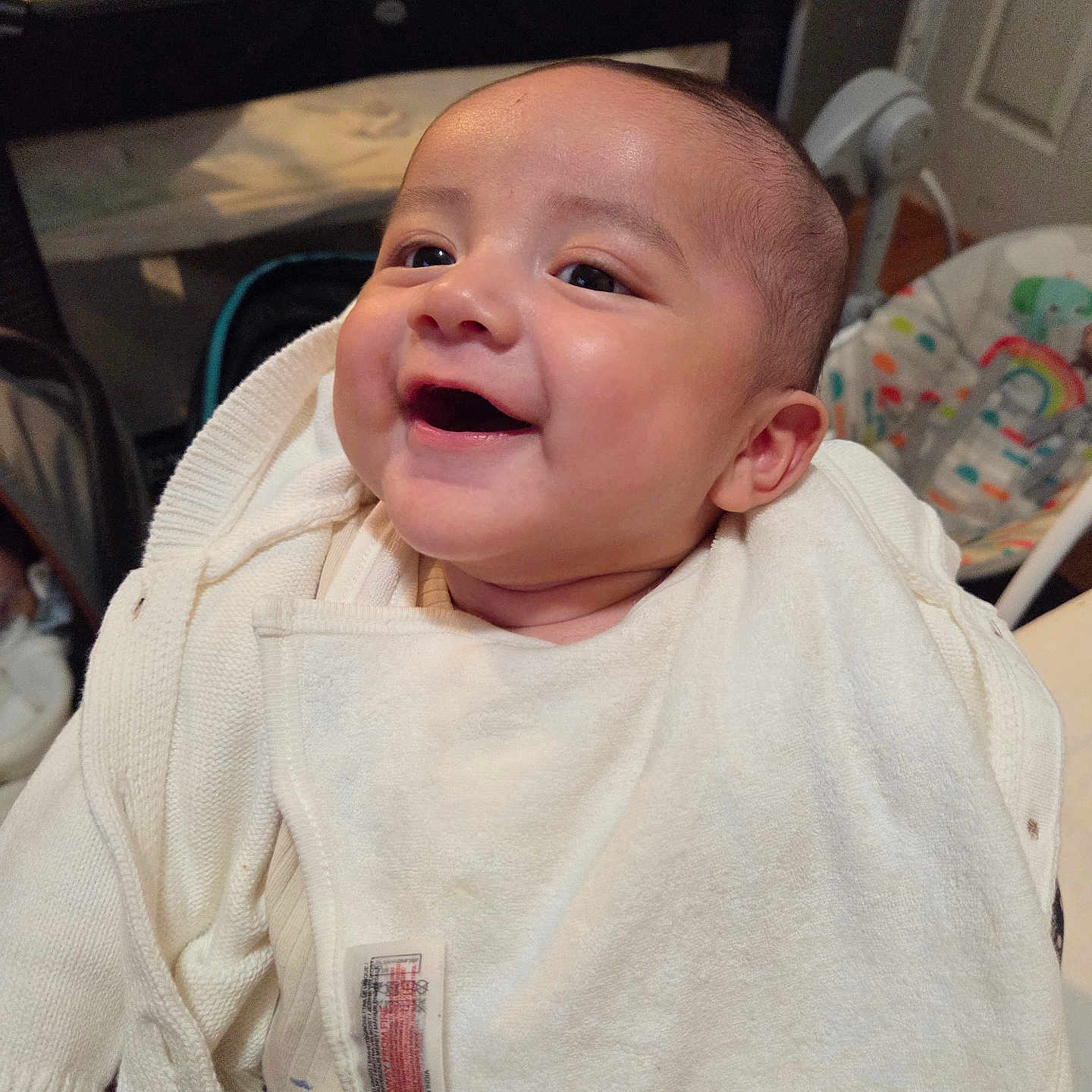 Iliam Morikone joined the competition — help win amazing prizes! baby, baby_gear, blanket, child, clothing, cozy, cute, face, happy, home, indoors, infant, joyful, newborn, person, portrait, sitting, smile, warm, white_blanket