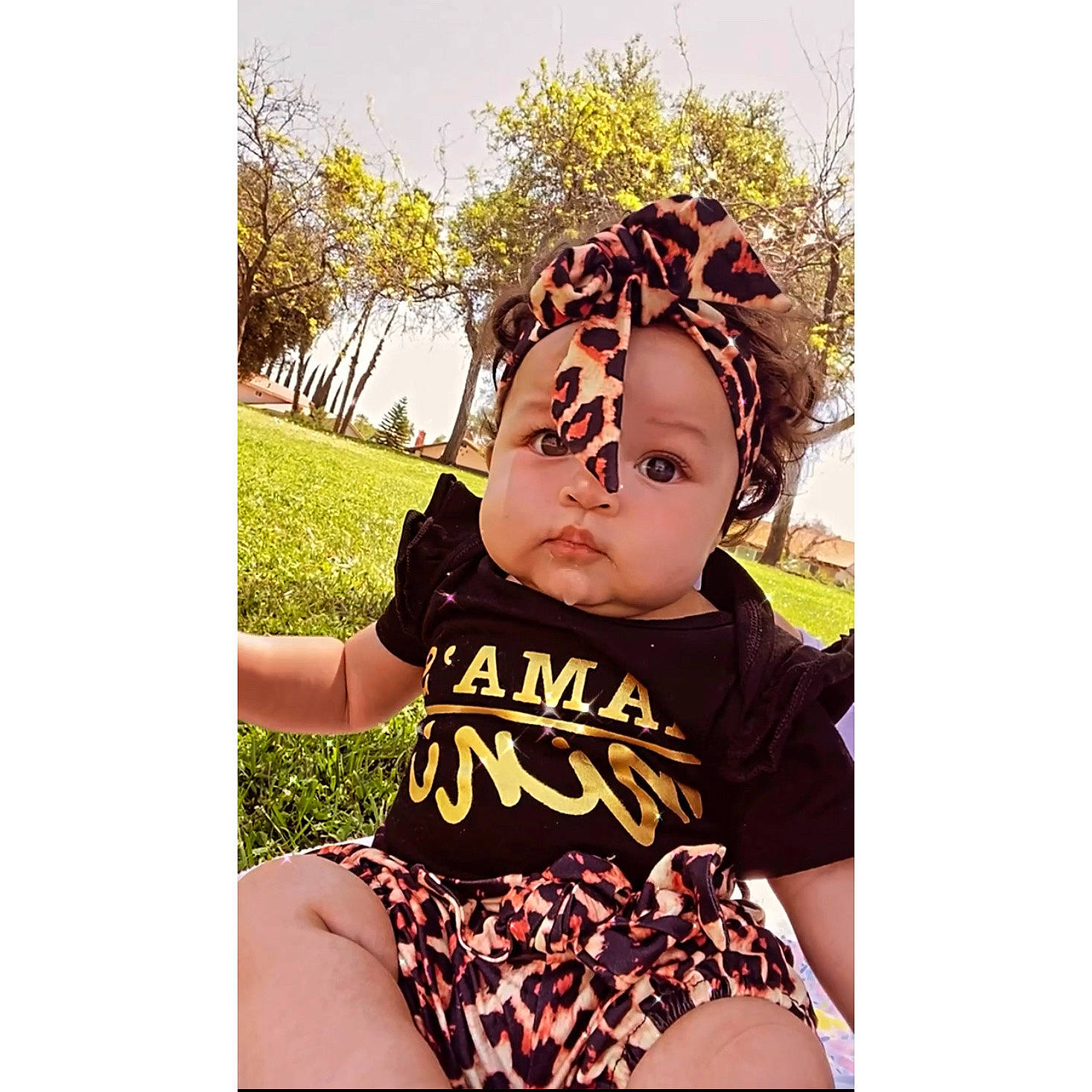 Amiyah Kehlani is registered to the contest to win money with this photo: baby, baby_toddler_clothing, cap, costume_hat, eyelash, font, grass, hair_accessory, happy, head, headband, headgear, headpiece, jewellery, pattern, person, plant, sleeve, thigh, toddler