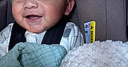 Aziel joined the competition — help win amazing prizes! baby, blanket, car_seat, child, closeup, clothing, comfort, cozy, cute, face, happy, indoors, infant, person, portrait, seatbelt, sleepy, smiling, warm, young_child