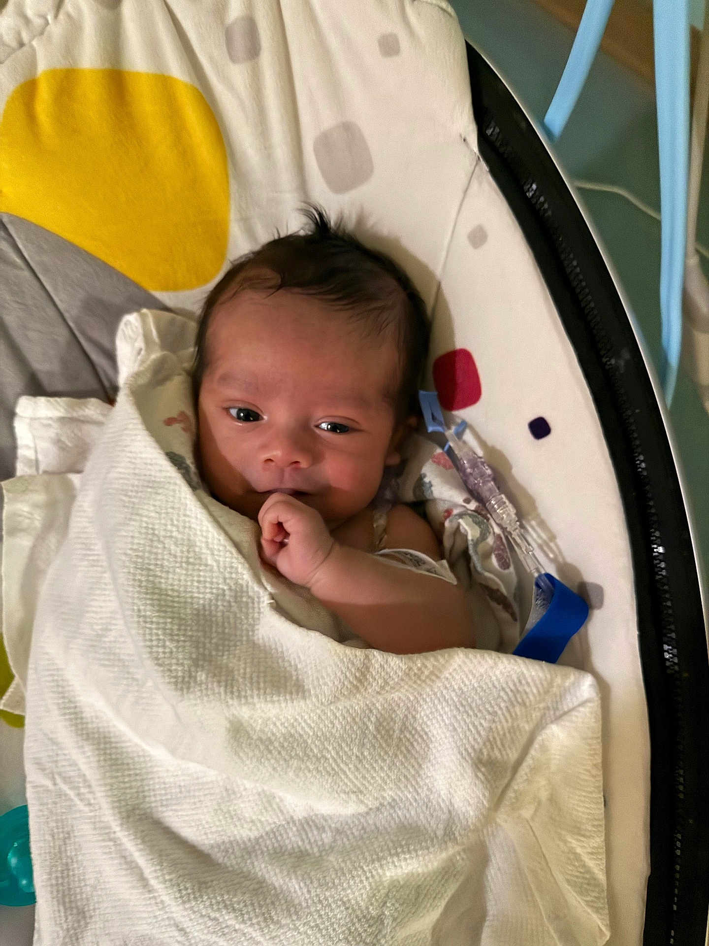 Aziel joined the competition — help win amazing prizes! baby, blanket, infant, face, hand, cushion, pattern, indoor, lying_down, wrapped, cute, newborn, comfort, resting, soft, expression, child, person, young, peaceful