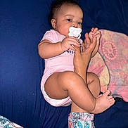 Ymiri Noelle joined the competition — help win amazing prizes! adult, baby, bed, blanket, blue_background, closeup, comfort, floral_pattern, foot, hand, indoor, infant, leg, lying_down, onesie, pacifier, person, skin, sleepwear, soft_toys