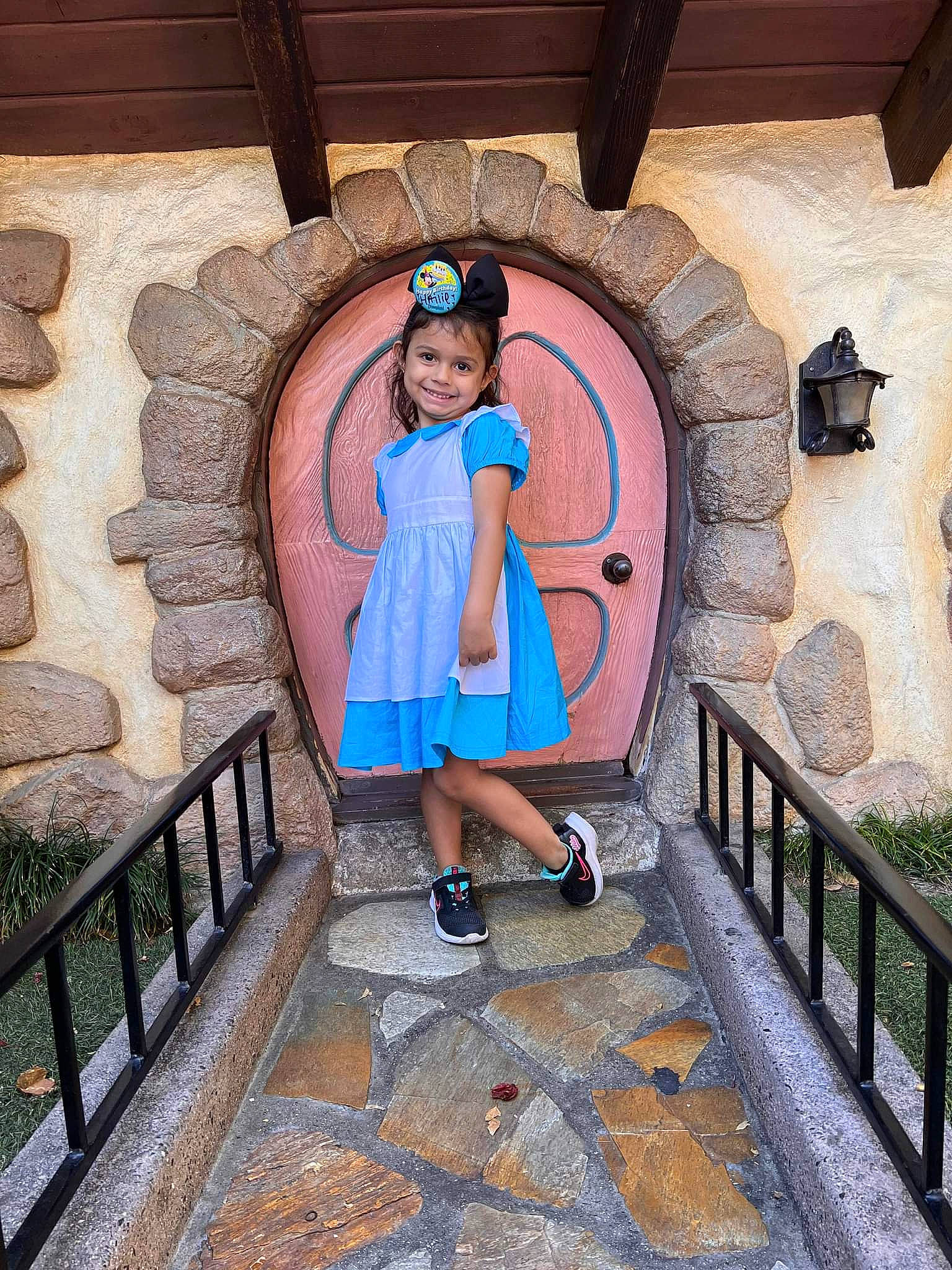 Hailie is registered to the contest to win money with this photo: arch, beauty, child, door, electric_blue, fun, handrail, headwear, interior_design, joy, leisure, person, plant, room, stairs, symmetry, temple, toddler, tourism, town