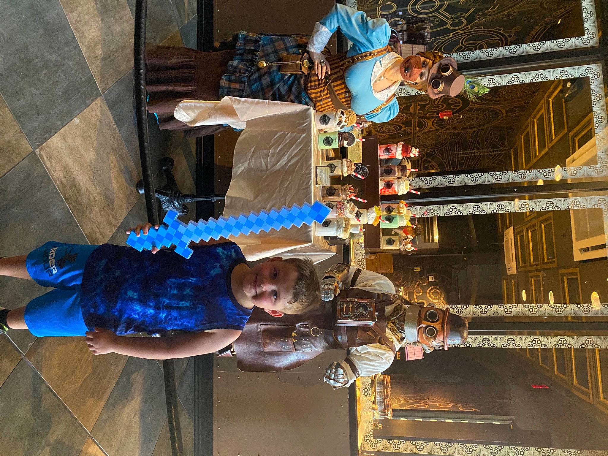 Jase is registered to the contest to win money with this photo: building, city, electric_blue, engineering, fun, headwear, joy, leisure, machine, metal, person, room, space, t_shirt, toddler, transport, wood, world