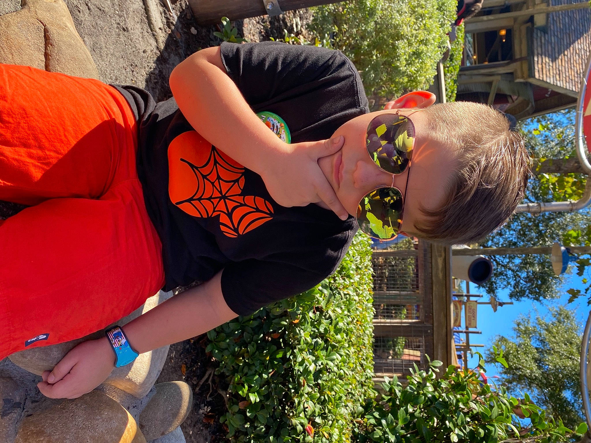 Jase is registered to the contest to win money with this photo: elbow, eyewear, fun, glasses, grass, hairstyle, human, joint, knee, leg, leisure, orange, person, plant, shoulder, street_fashion, sunglasses, thigh, tree, waist