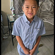 Jayzen joined the competition — help win amazing prizes! blanket, boy, casual_clothing, child, couch, curtains, floor, furniture, happy, home, indoor, mirror, pants, person, portrait, shirt, smile, socks, standing, table