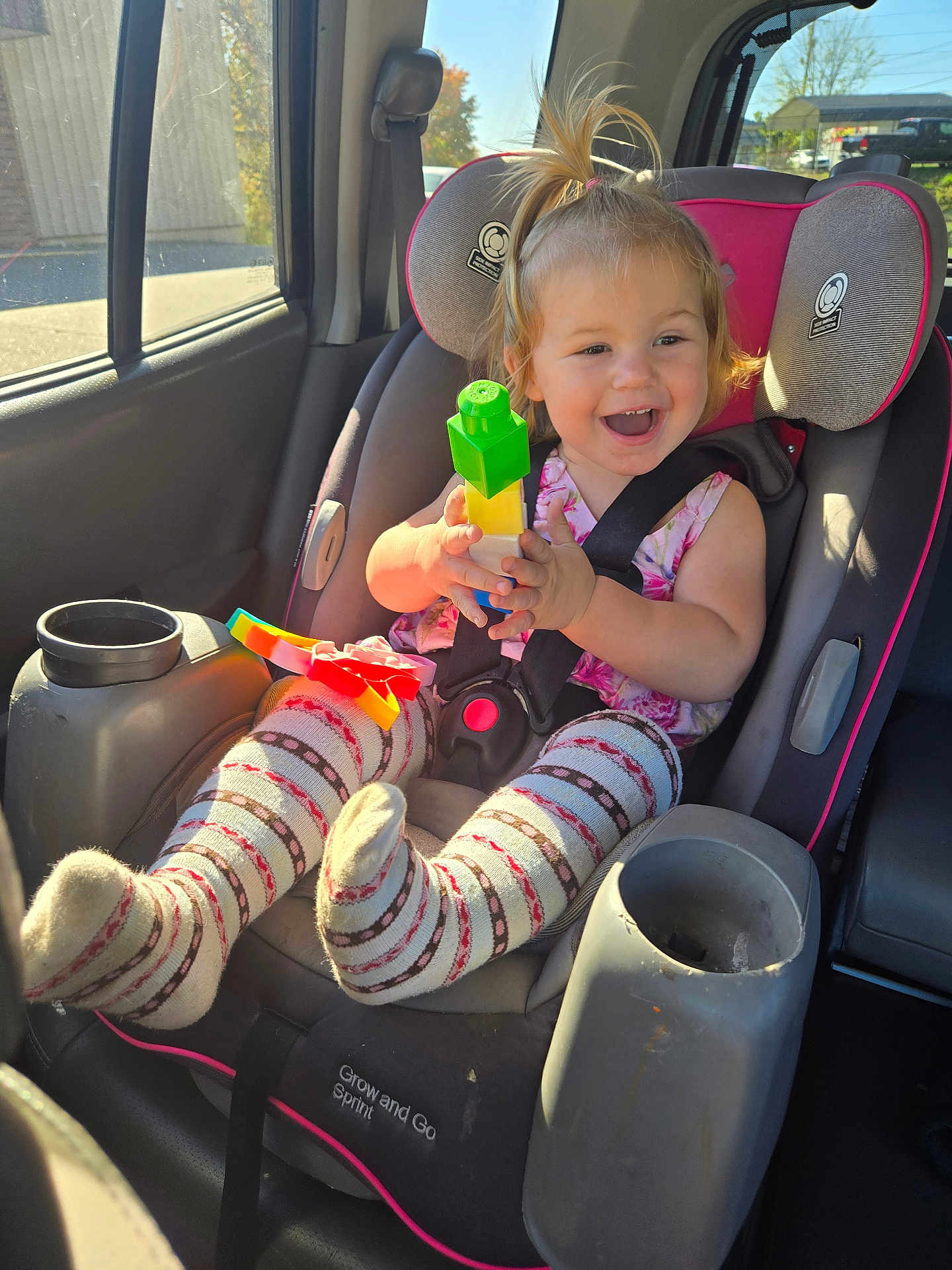Chevelle is registered to the contest to win money with this photo: baby, car, car_interior, carseat, clothing, cream, cushion, dessert, face, food, head, homedecor, hosiery, icecream, person, photography, portrait, sock, transportation, vehicle