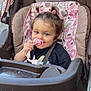 Anna joined the competition — help win amazing prizes! toddler, child, stroller, pacifier, pigtails, blue_eyes, pink, black_shirt, seatbelt, outdoor, daylight, baby, cute, smiling, person, toy, face, legs, plastic, fabric
