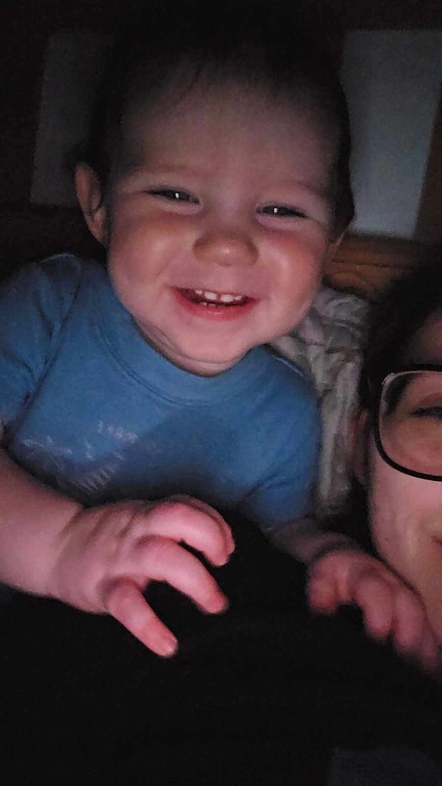 Raiden joined the competition — help win amazing prizes! toddler, child, smile, happy, face, hand, glasses, adult, person, indoor, closeup, portrait, baby, blue_shirt, skin, cute, expression, joy, family, casual