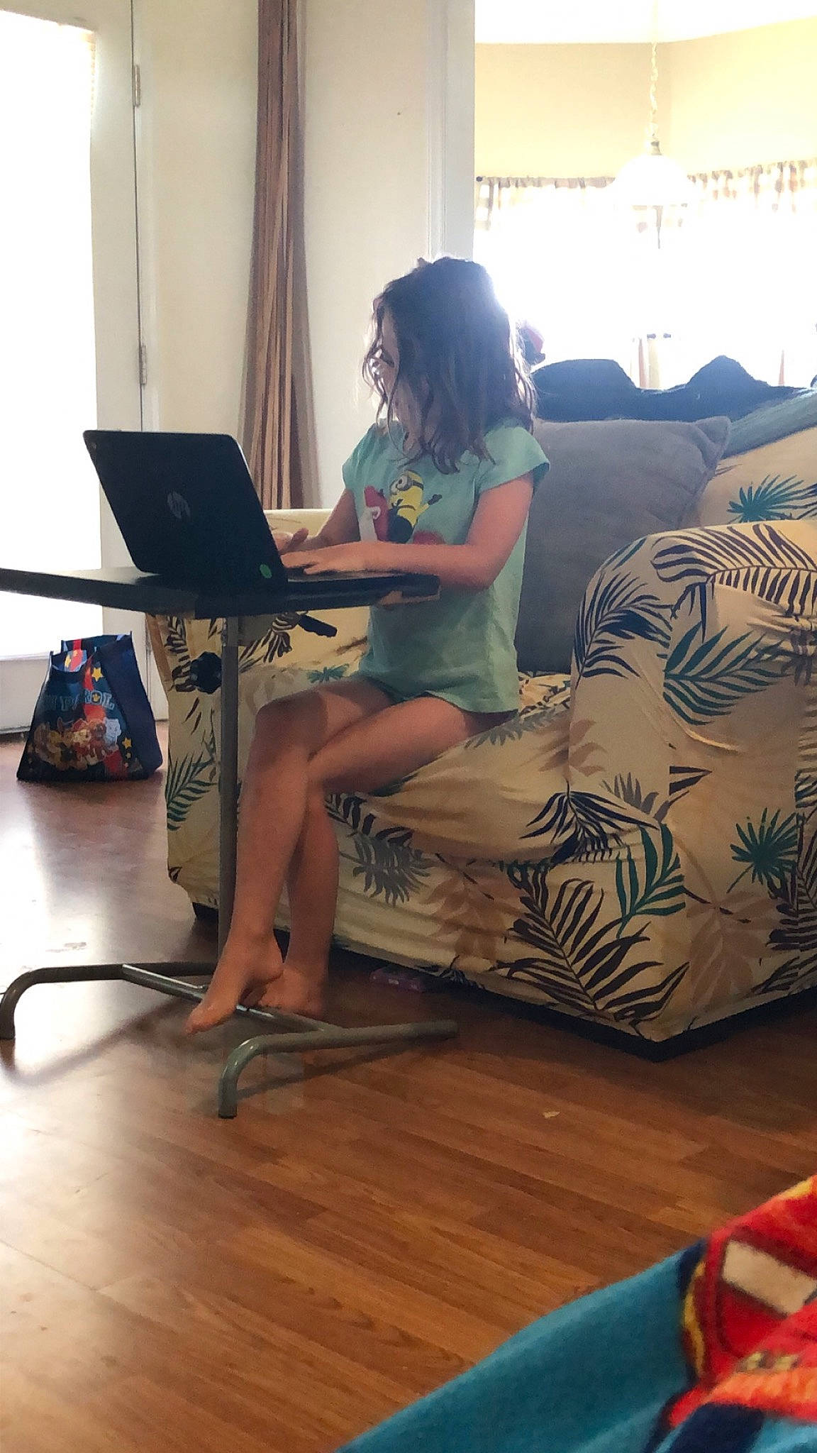 Rose joined the competition — help win amazing prizes! computer, desk, electronic_device, floor, flooring, furniture, human_leg, leg, person, reading, room, sitting, table, technology, thigh