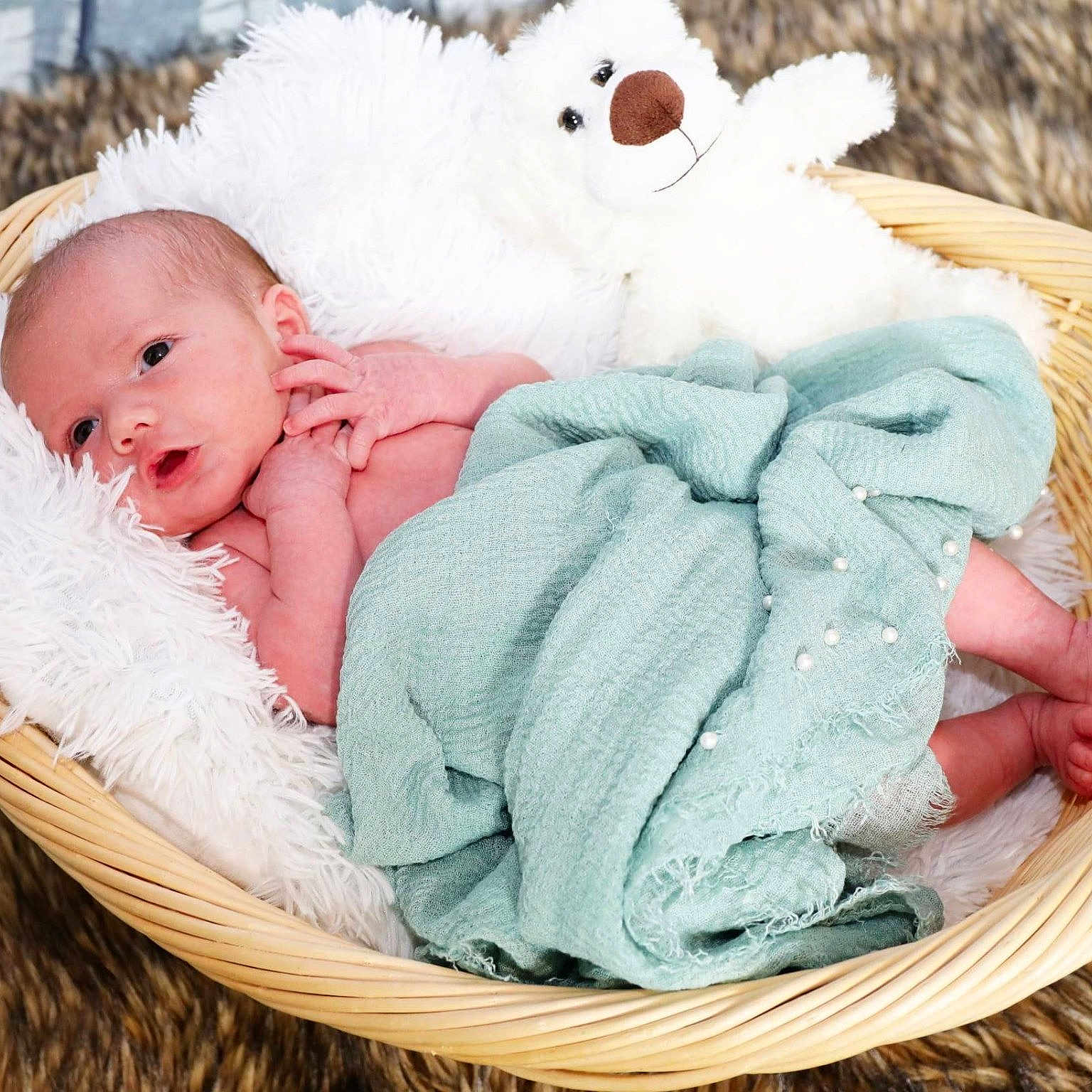 Luka is registered to the contest to win money with this photo: baby, basket, blanket, cozy, curious, cute, decor, indoors, infant, lying_down, newborn, peaceful, pillow, portrait, skin, soft_texture, teddy_bear, warm, wide_eyes, wrapped